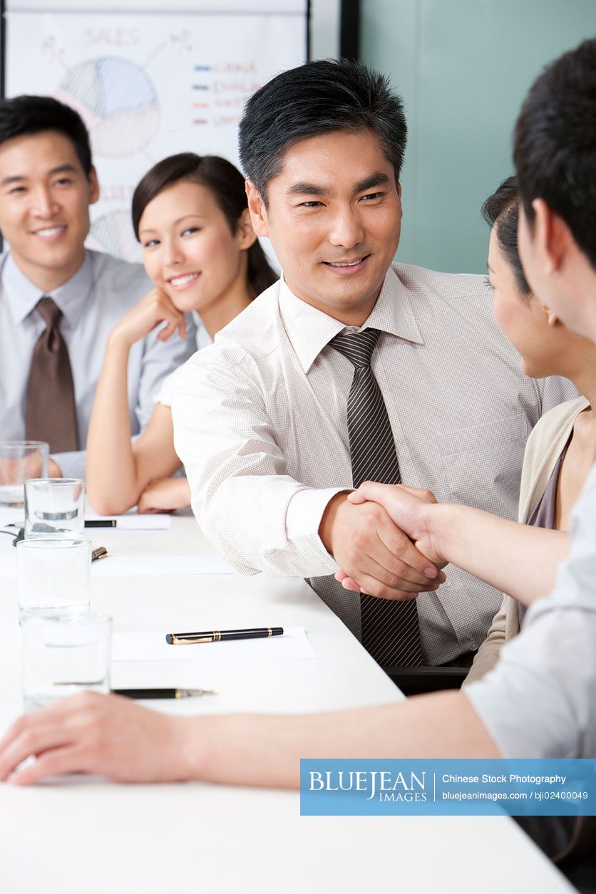 Chinese businessmen making a deal-High-res stock photo for download