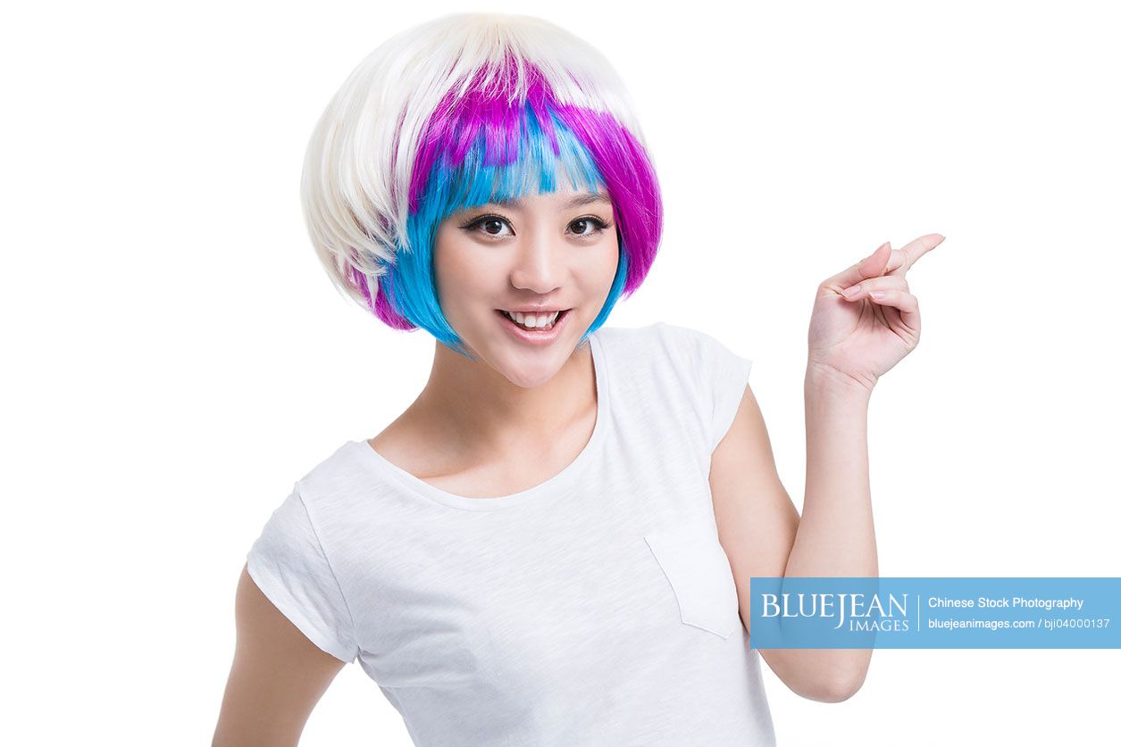 Young Chinese woman with colorful wigs