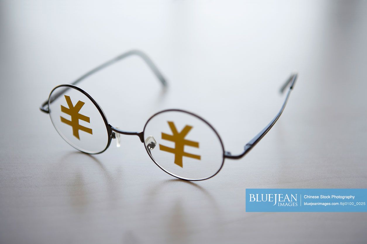 Glasses with Yuan characters on the lenses
