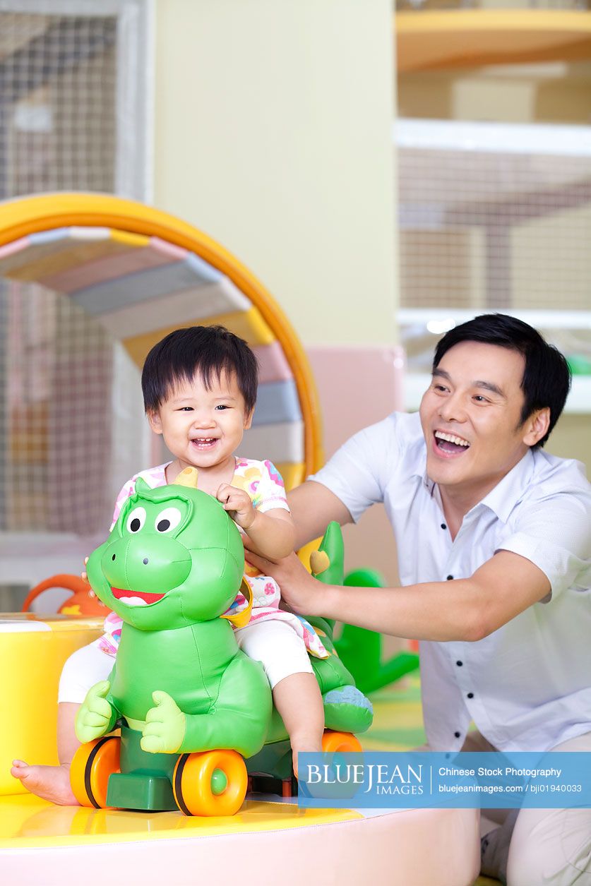 Chinese father playing with daughter