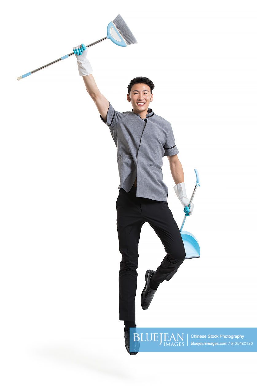 Cheerful Chinese cleaner jumping