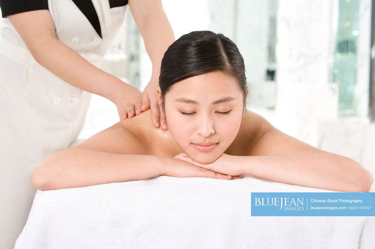 Young Chinese woman getting a massage