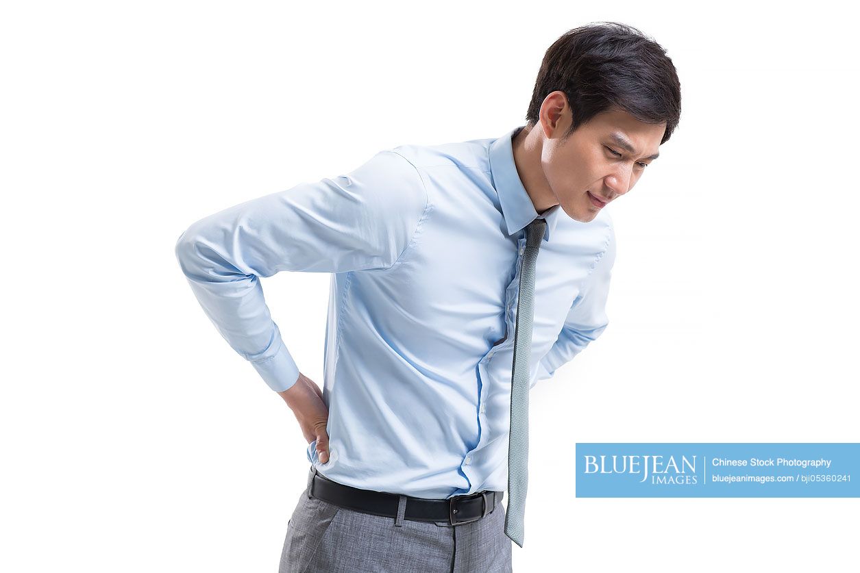 Young Chinese businessman suffering from backache