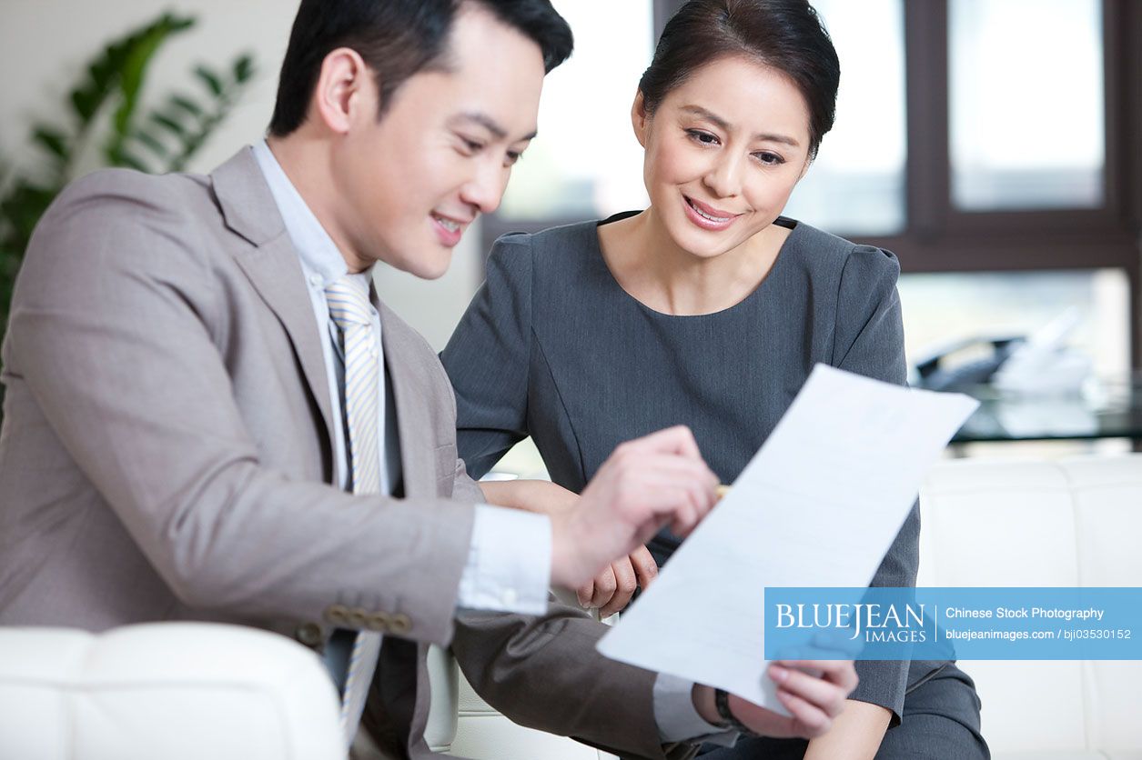 Chinese business partners in discussion