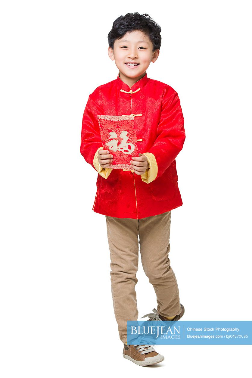 Happy Chinese boy holding a red envelope