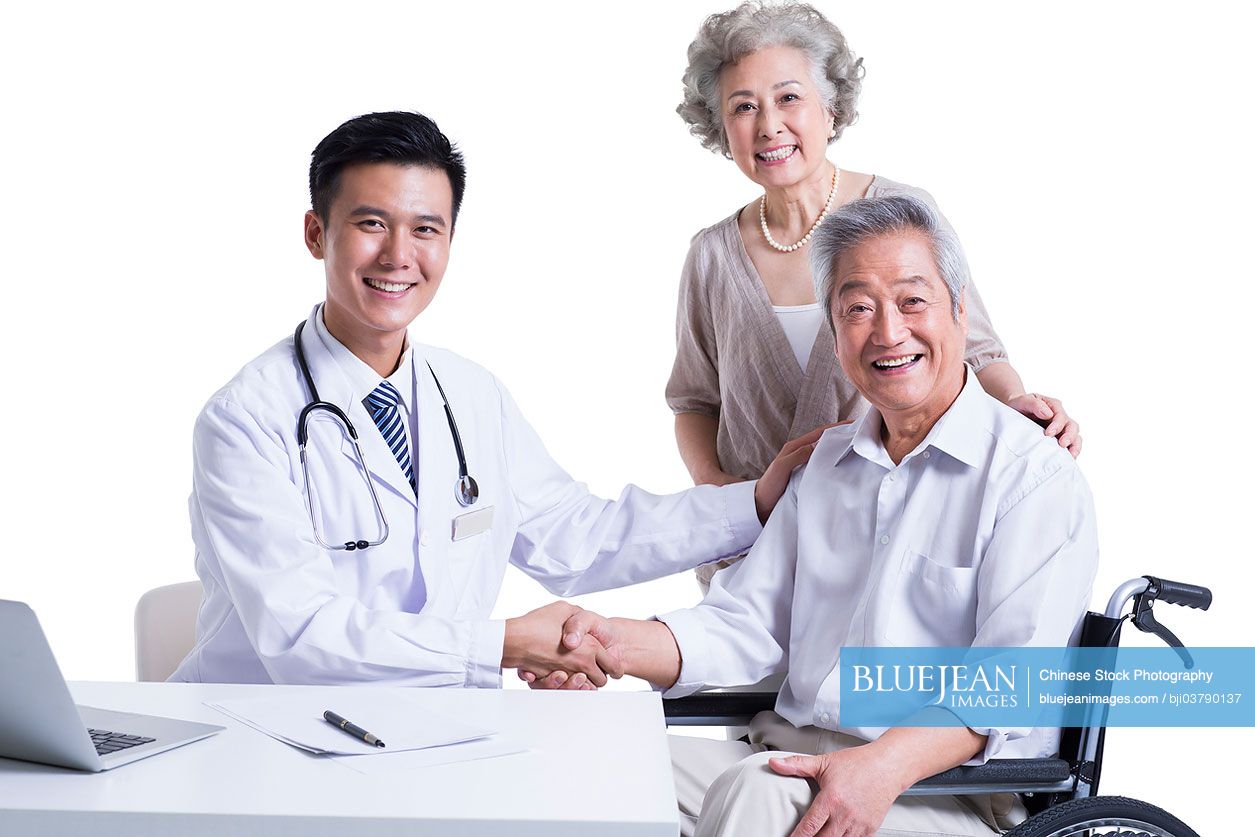 Chinese doctor and patient shaking hands