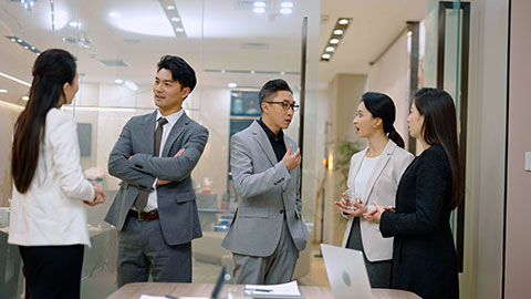 Confident Chinese business people having a meeting