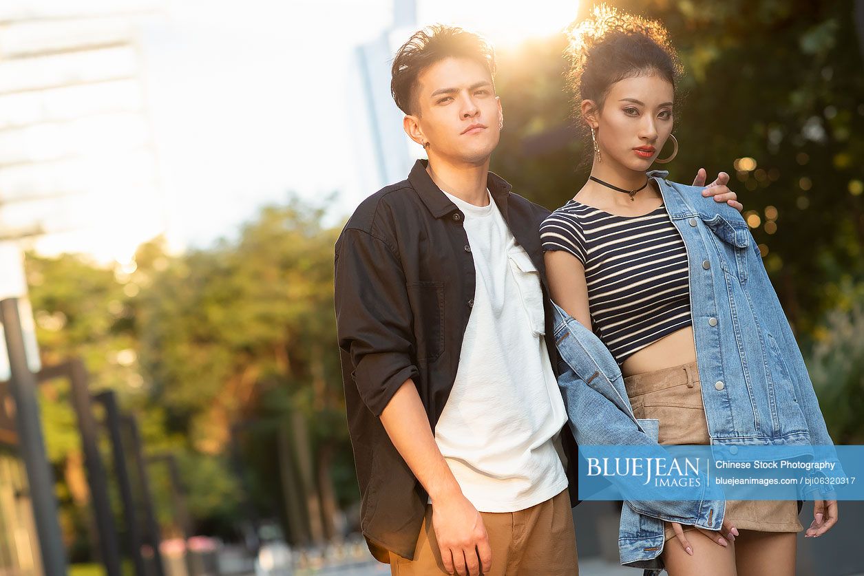 Fashionable young Chinese couple on street