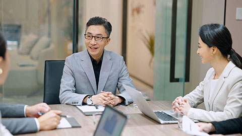 Confident Chinese business people having a meeting