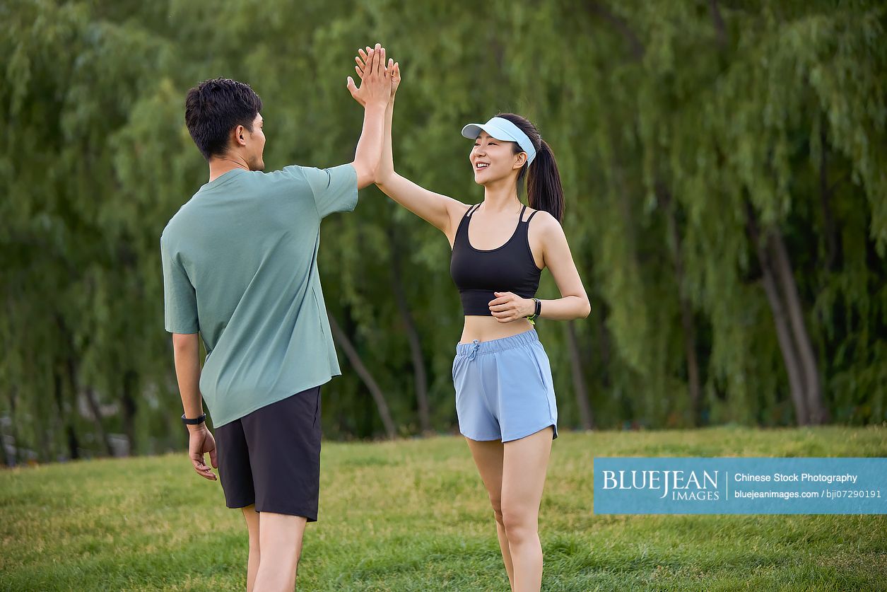 Young couple exercising in the heart of nature embracing the fresh air and natural surroundings