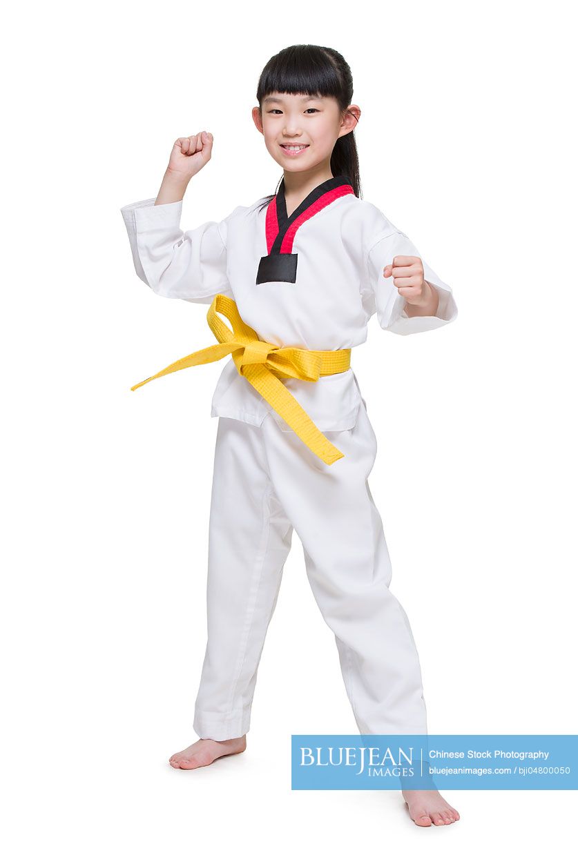 Cute Chinese girl practicing Tae Kwon Do