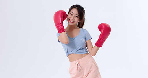 Cute young Chinese woman practicing boxing,4K