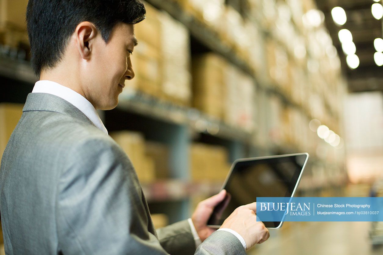 Chinese businessman and digital tablet