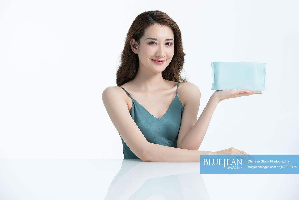 Beautiful Young Chinese Woman Showing Wet Wipe High res Stock Photo For beautiful-young-chinese-woman-showing-wet-wipe-high-res-stock-photo-for