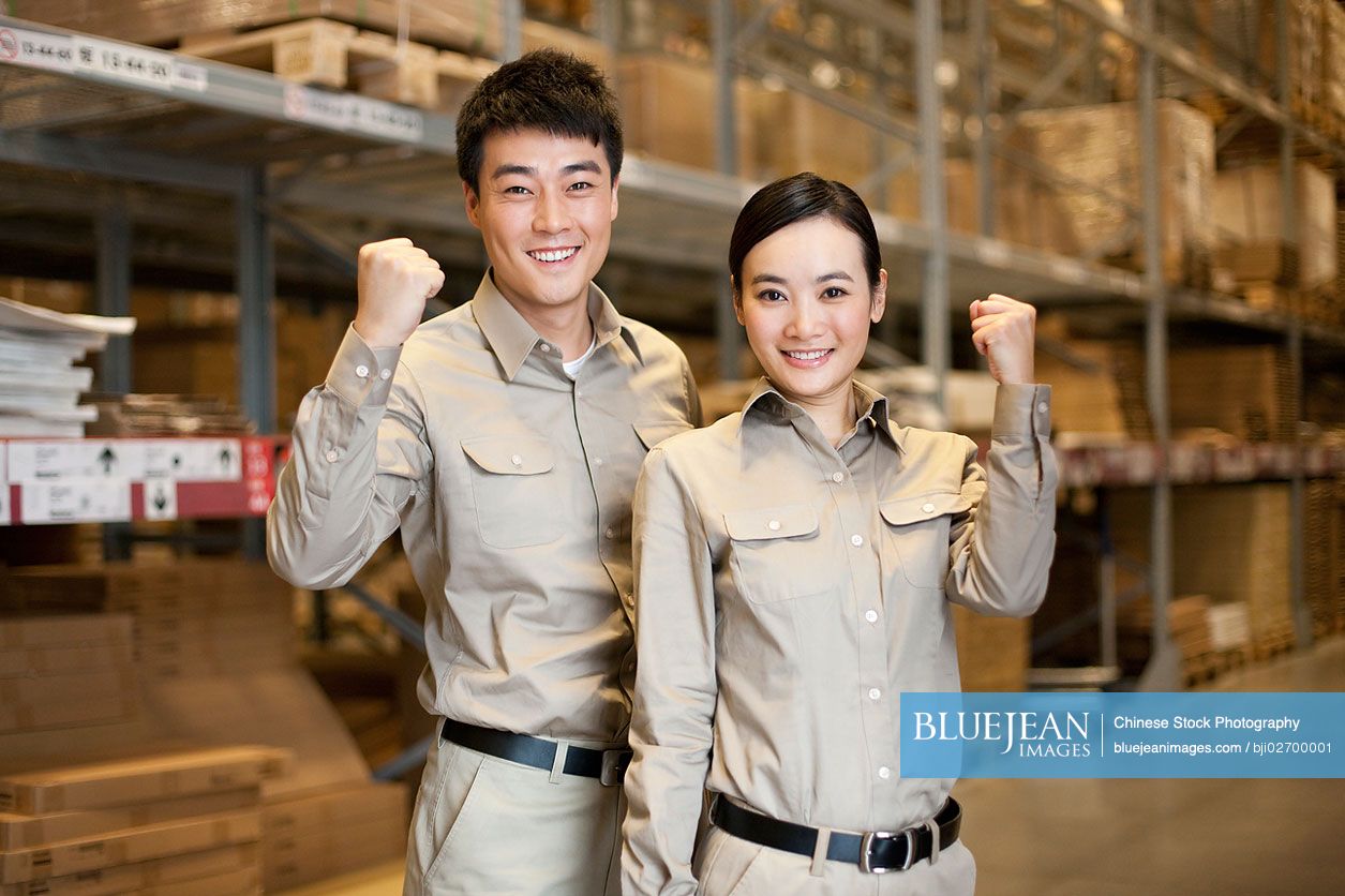 Male and female Chinese warehouse workers