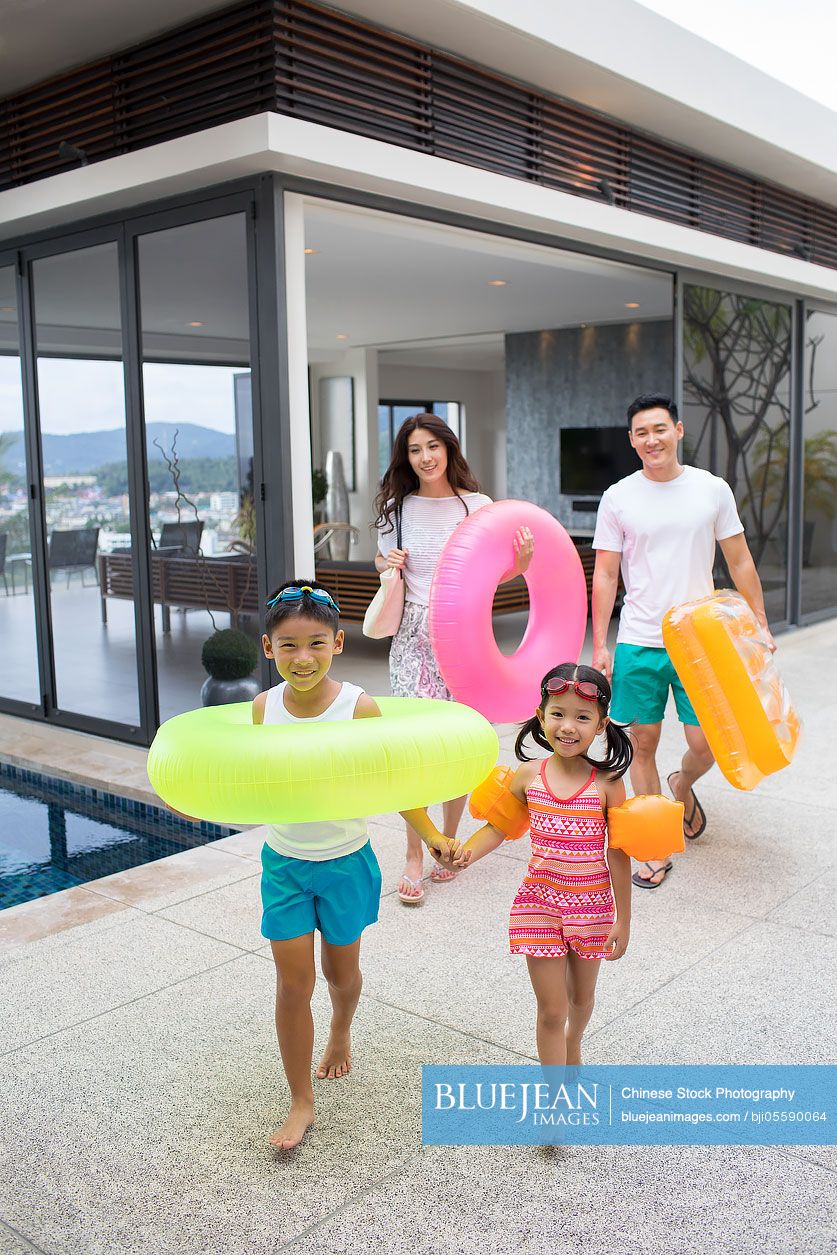 Happy young Chinese family on vacation