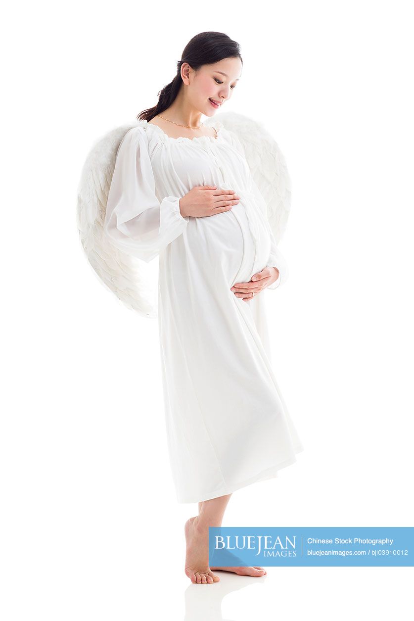 Pregnant Chinese woman wearing angel wings