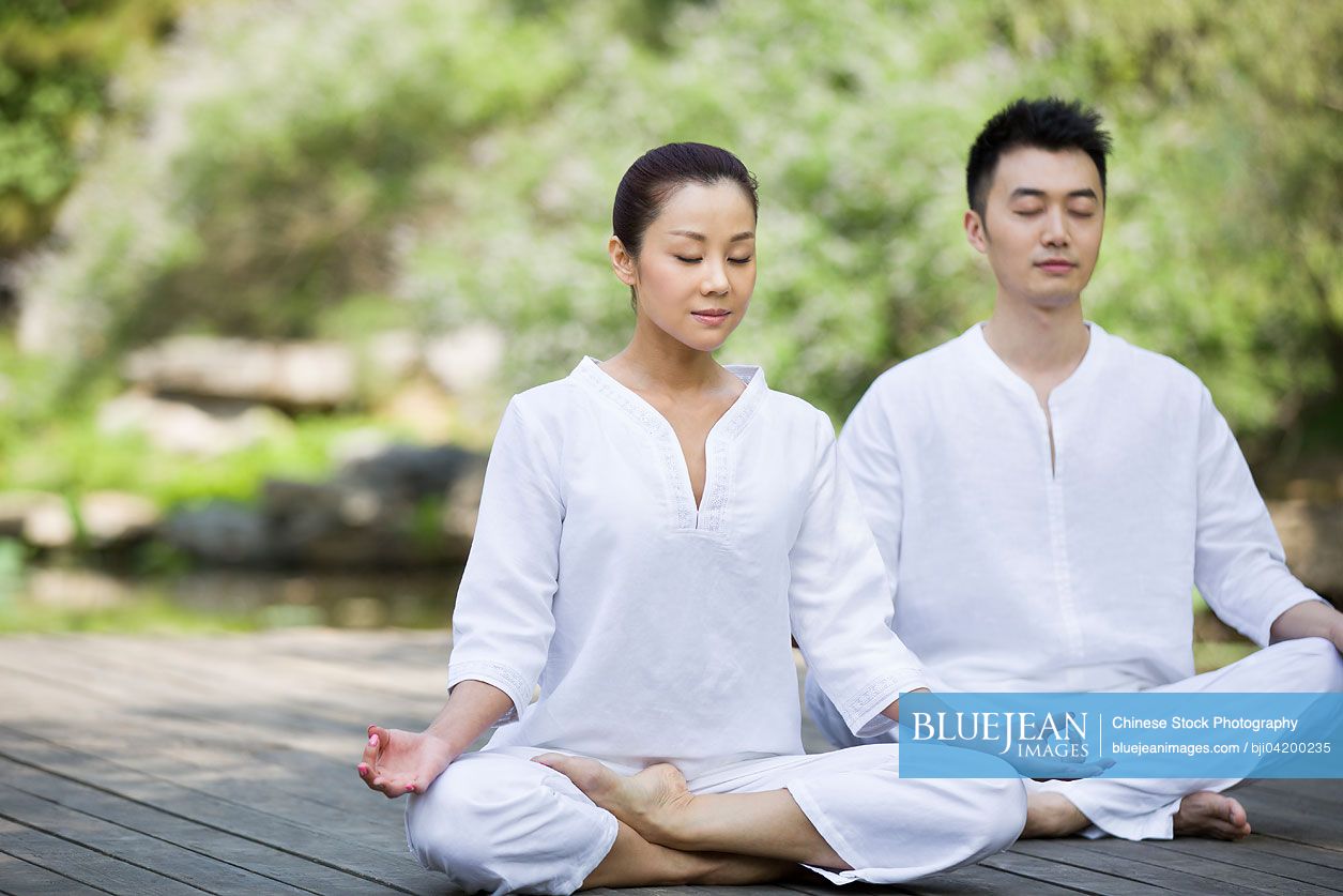 Young Chinese adult practicing yoga