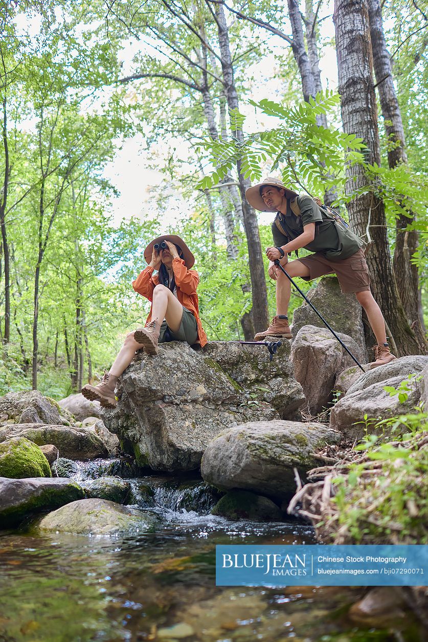 Happy couple hiking through the serene beauty of nature