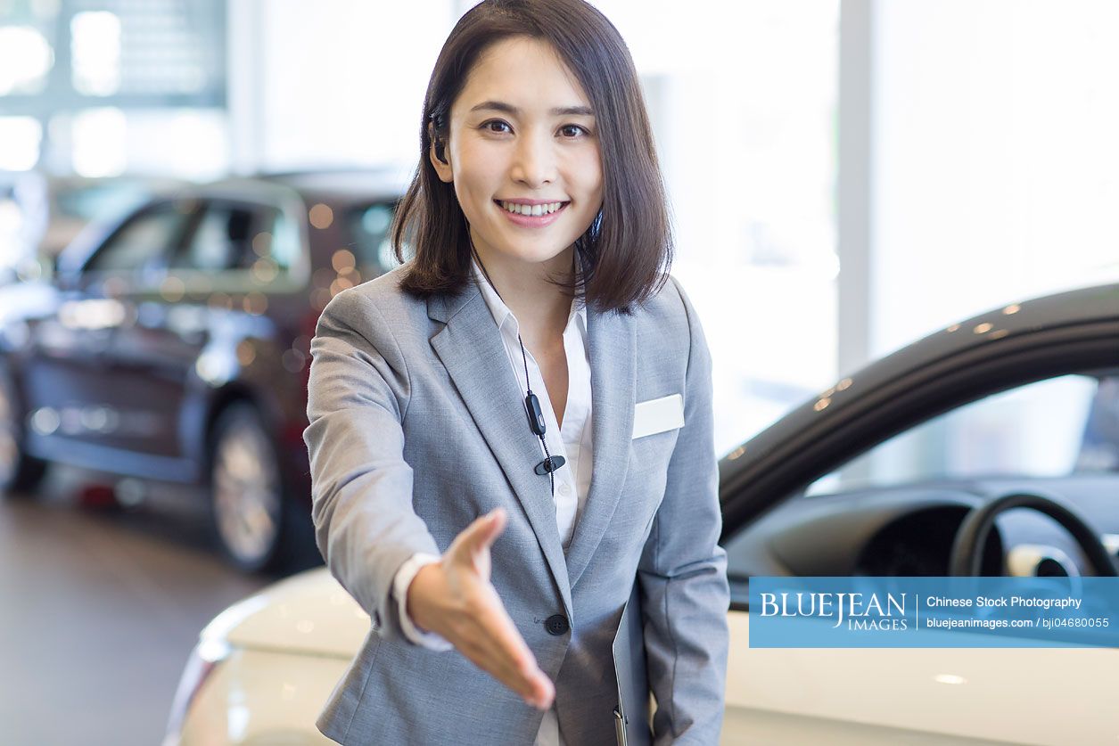 Chinese car saleswoman greeting