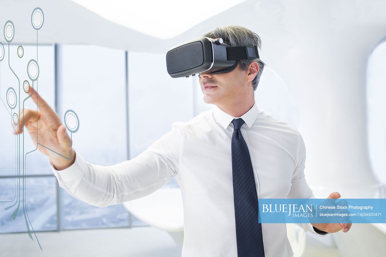 Businessman wearing VR glasses in office