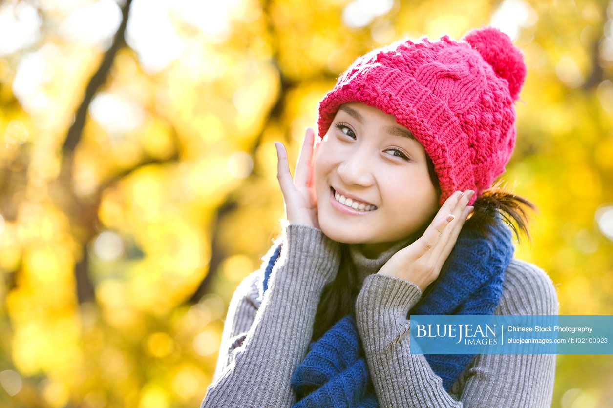 Young Chinese man in a park in autumn