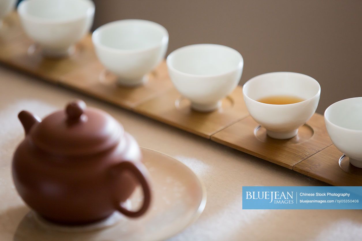 Tea pot and tea cups in tea room