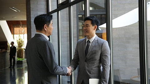 Confident Chinese businessmen shaking hands,HD