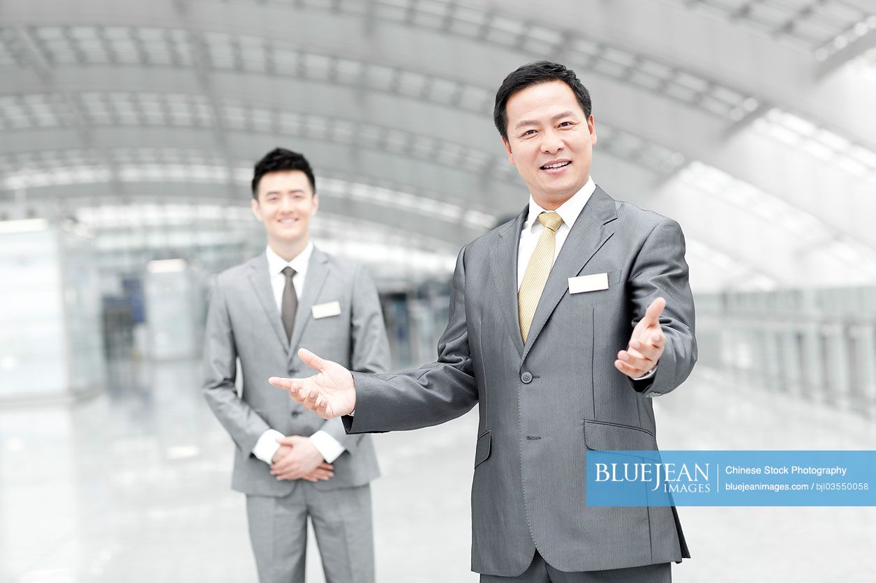 Chinese airport staff members in airport lobby