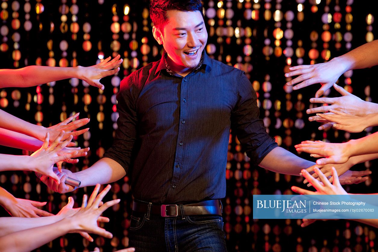 Chinese man singing karaoke