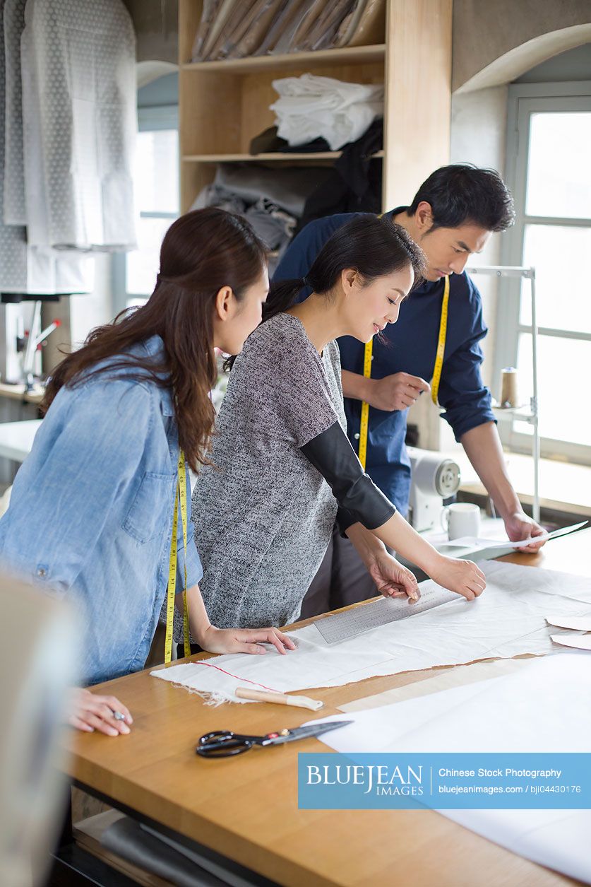 Chinese fashion designers working in studio