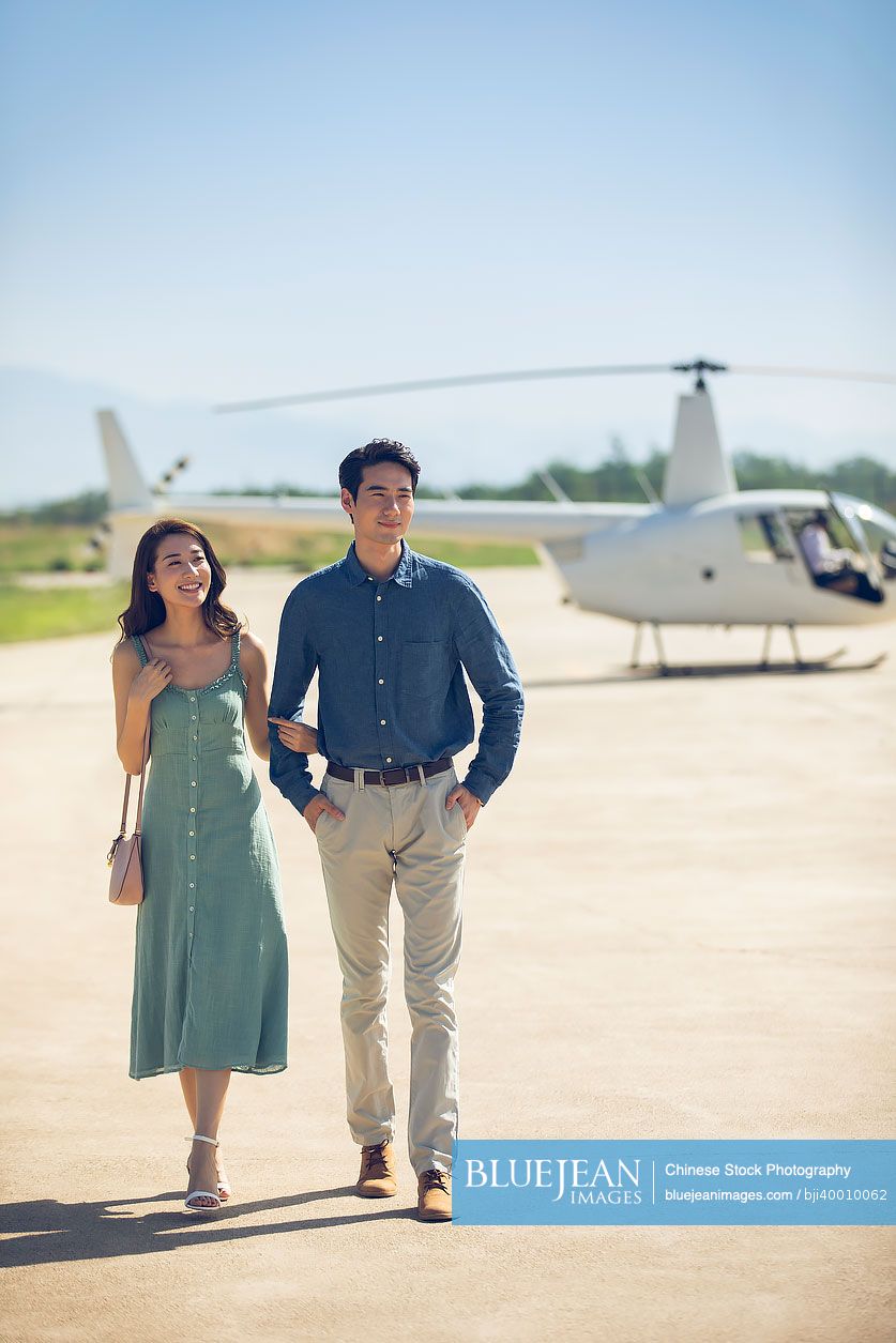 Young couple travelling by helicopter