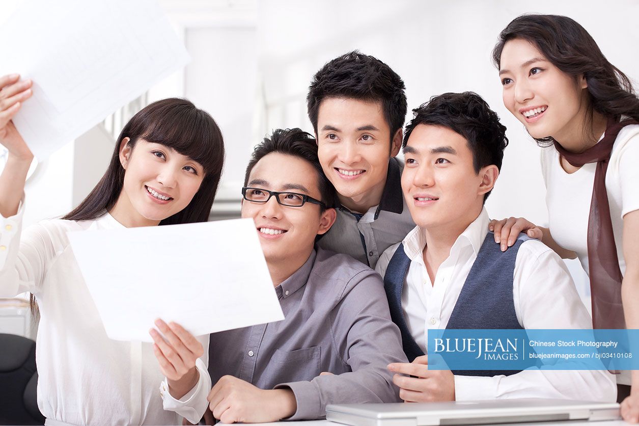 Busy Chinese office workers in meeting