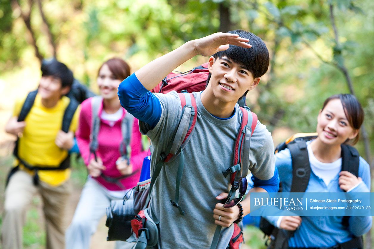 Young Chinese go hiking in mountain