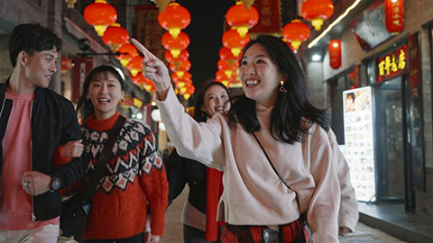 Happy young Chinese friends celebrating Chinese new year,4K