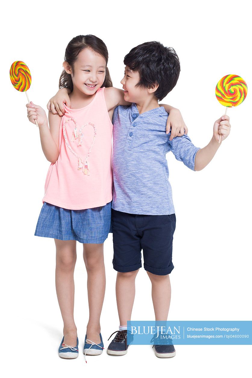 Happy Chinese children with lollipops