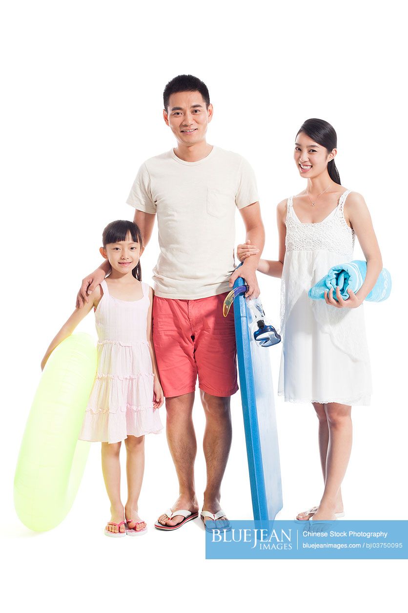 Happy Chinese family ready for beach travelling