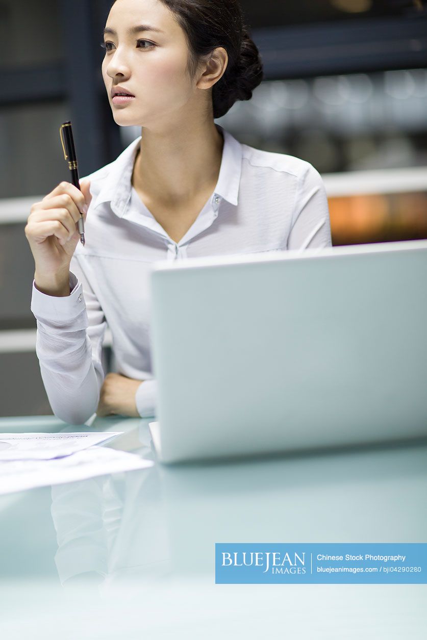 young-chinese-businesswoman-working-in-office-high-res-stock-photo-for