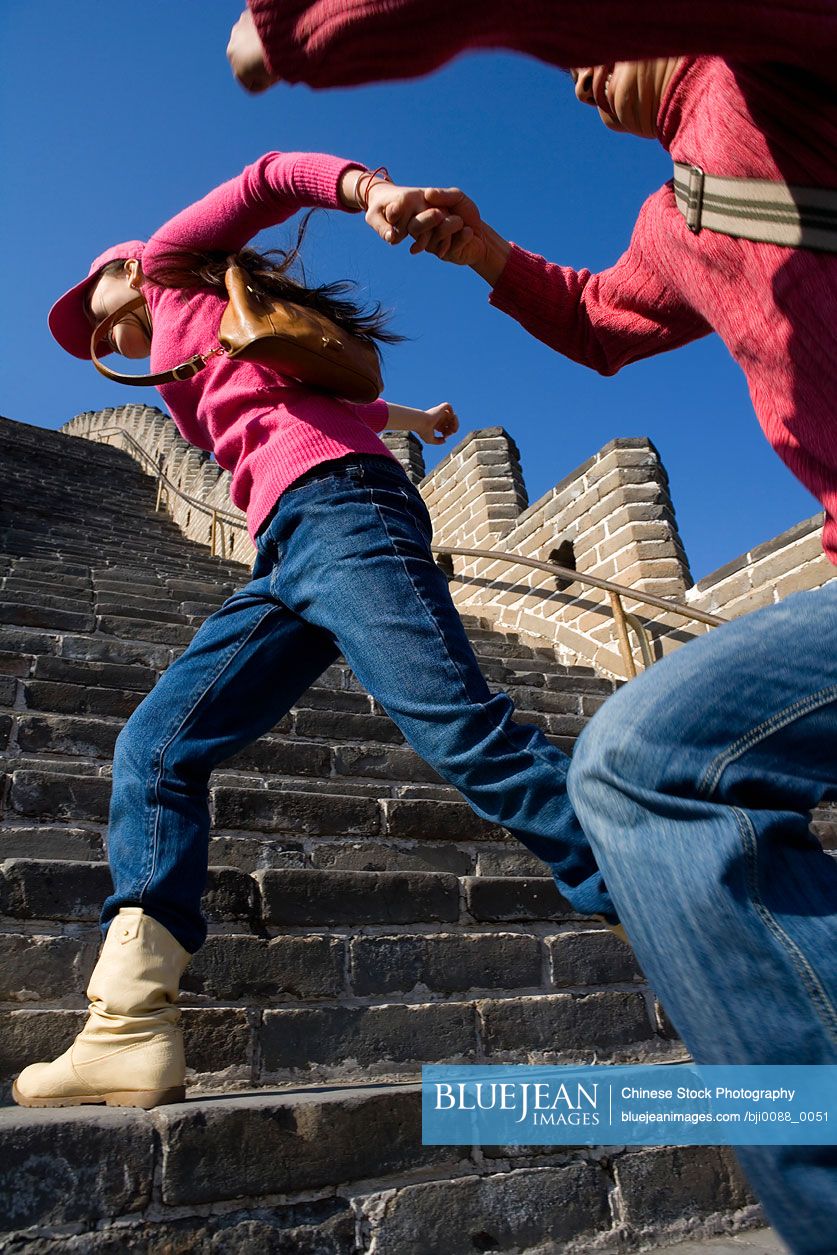 young-chinese-couple-visiting-the-great-wall-of-china-high-res-stock