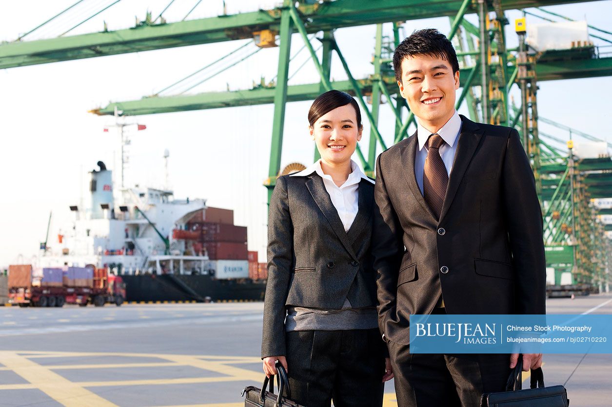 Chinese businesspeople at a shipping port