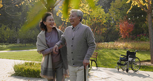 Cheerful senior Chinese couple relaxing in the park,4K
