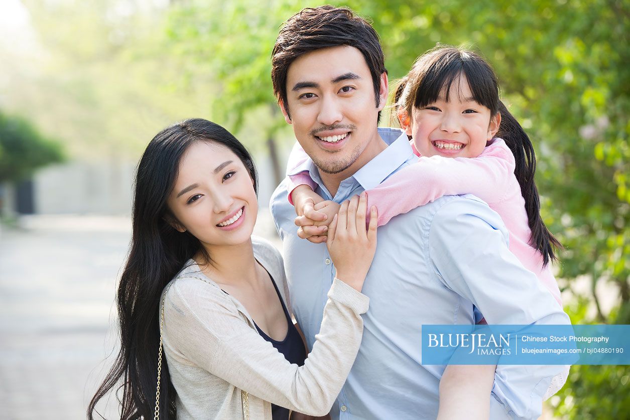 Portrait of happy young Chinese family