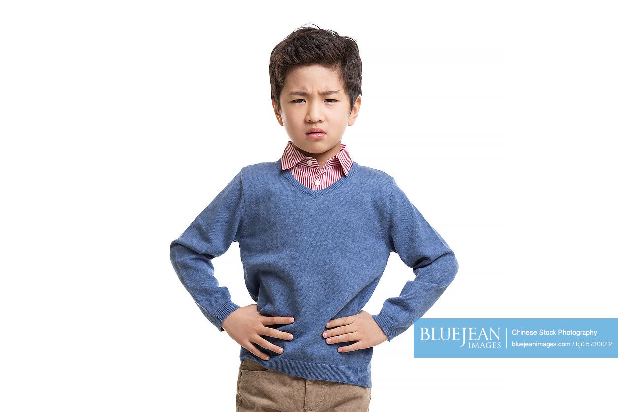 Little Chinese boy frowning