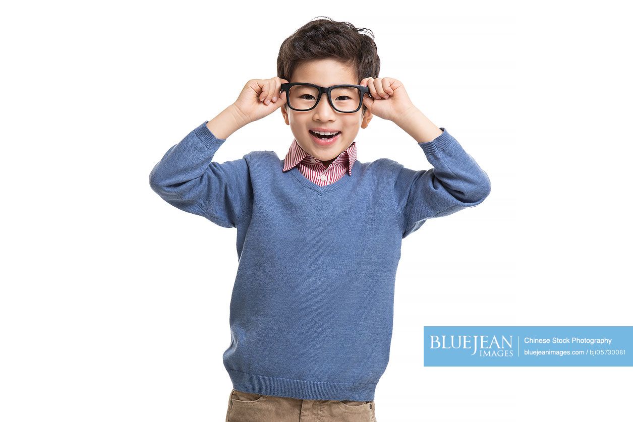 Happy little Chinese boy wearing glasses