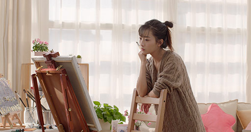 Young Chinese woman painting at home,4K