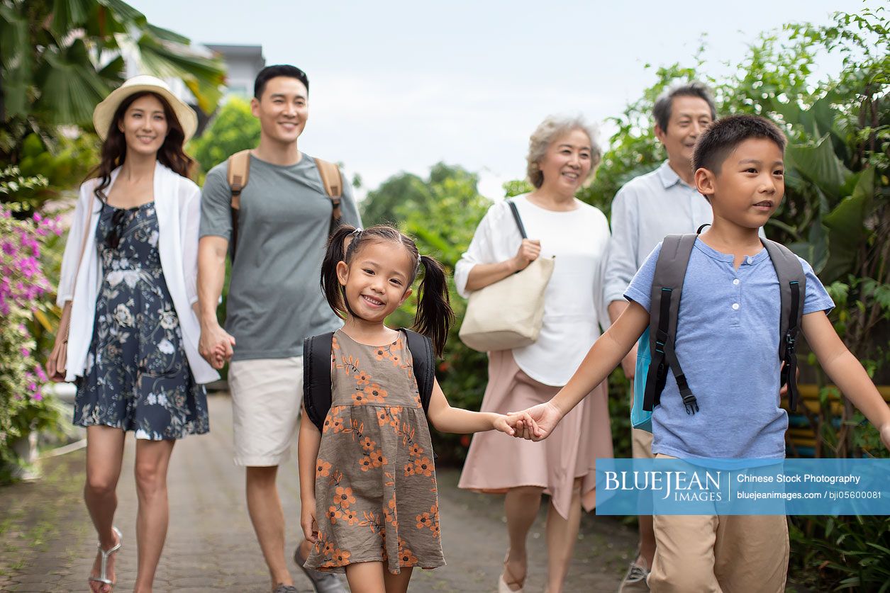 Happy Chinese family enjoying vacation