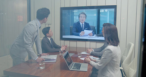 Confident Chinese business people having video conference,4K