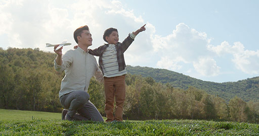 Happy young Chinese father and son having fun outdoors,4K