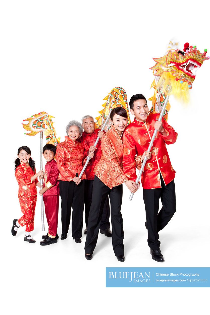 Family Dressed in Traditional Clothing Celebrating Chinese New Year