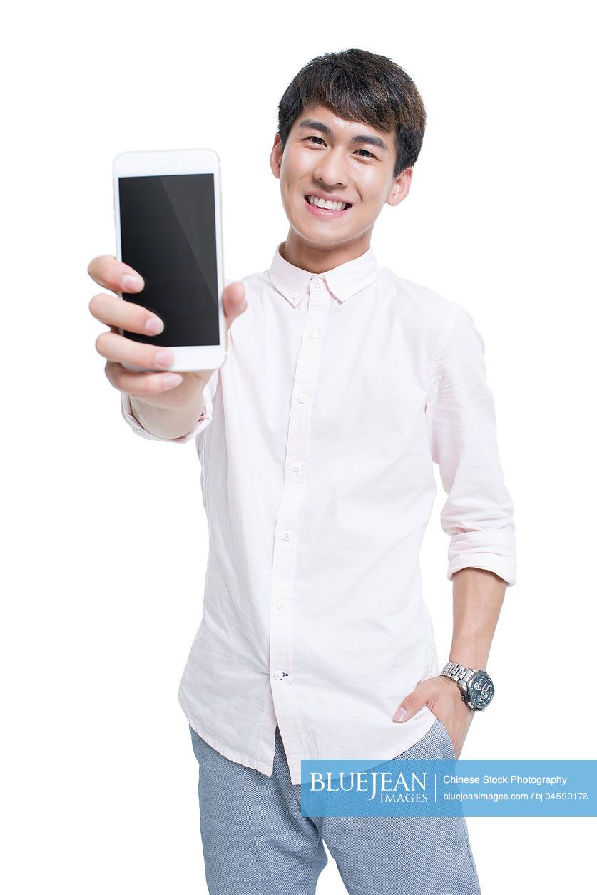 Young Chinese man showing smart phone